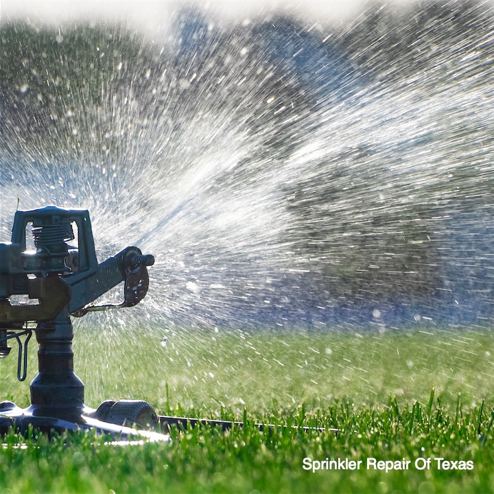 automatic-sprinkler-system-watering-lawn-close-up