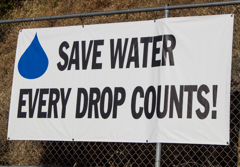banner that says "save water every drop counts!"